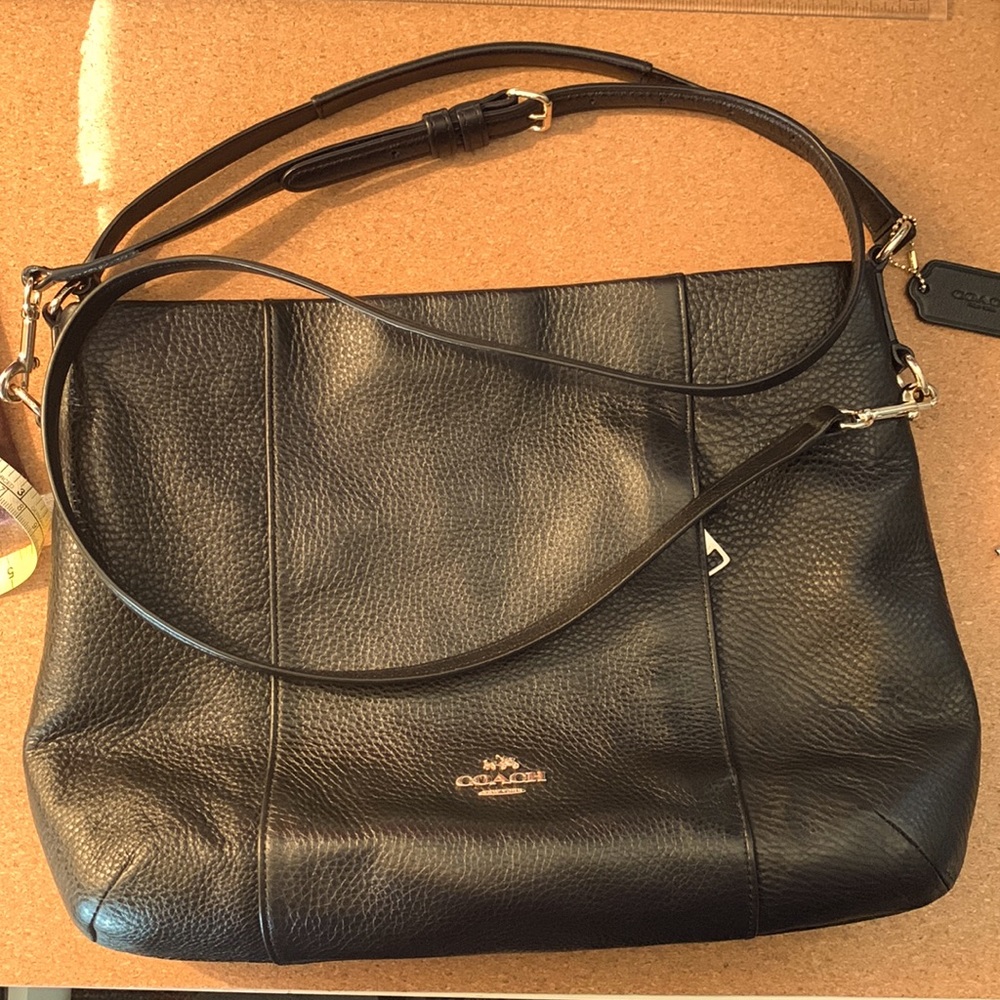 Beautiful, low profile Coach shoulder bag with detachable cross body strap.